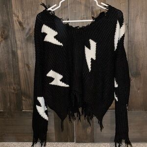 Distressed lightening sweater